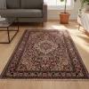 3x5-malayer-antique-rug-in-room-2 {image_id: crop_1, image_type: detail_photo, alt_text: Detail view of the top left corner of the rug, showing floral motifs and border patterns.}